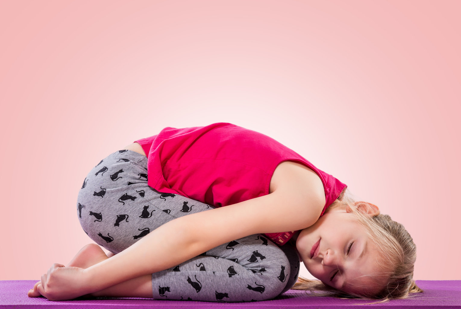 Premium Photo | Young woman doing yoga child pose