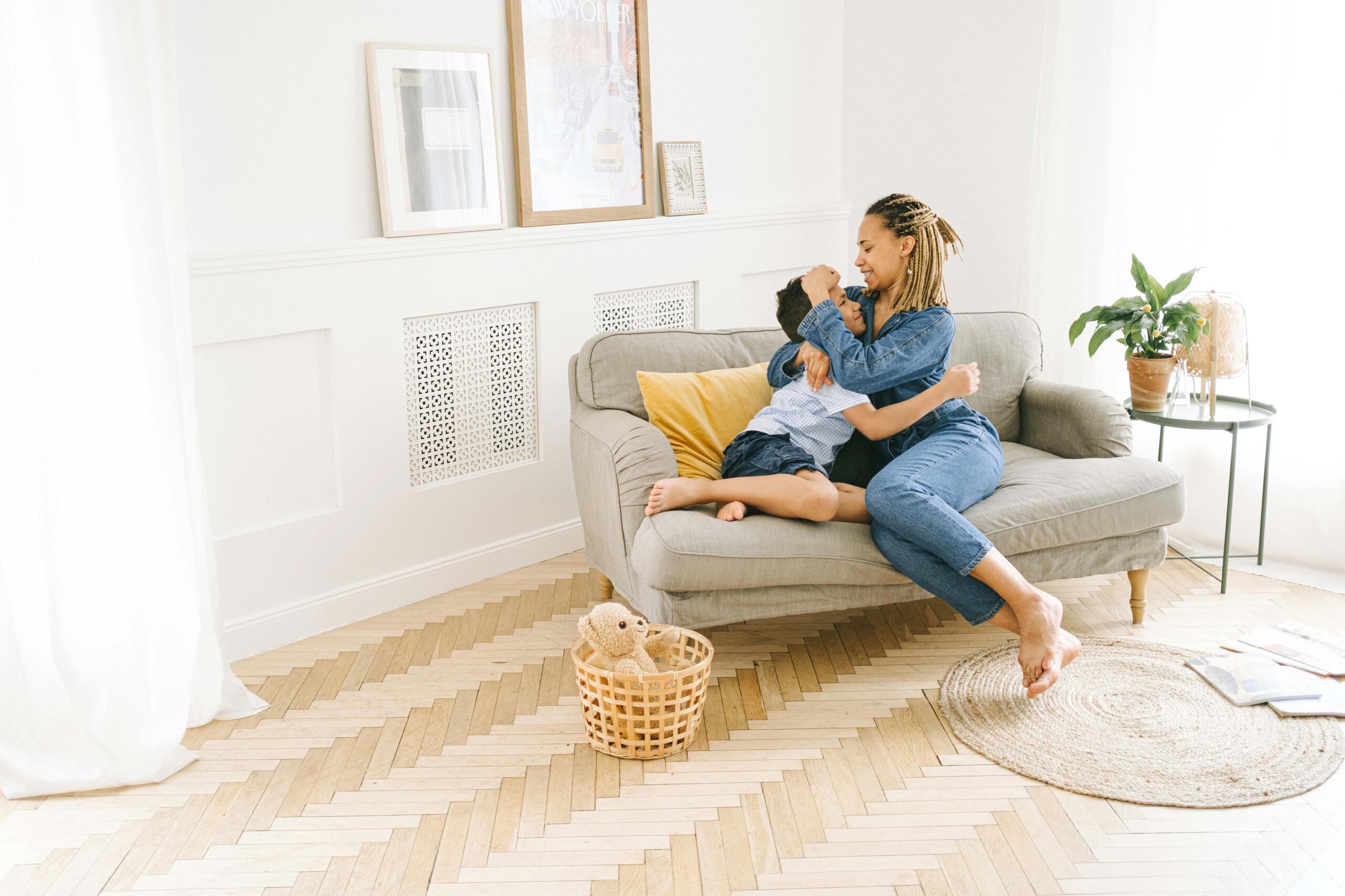 A mother and son hugging each other on a couch