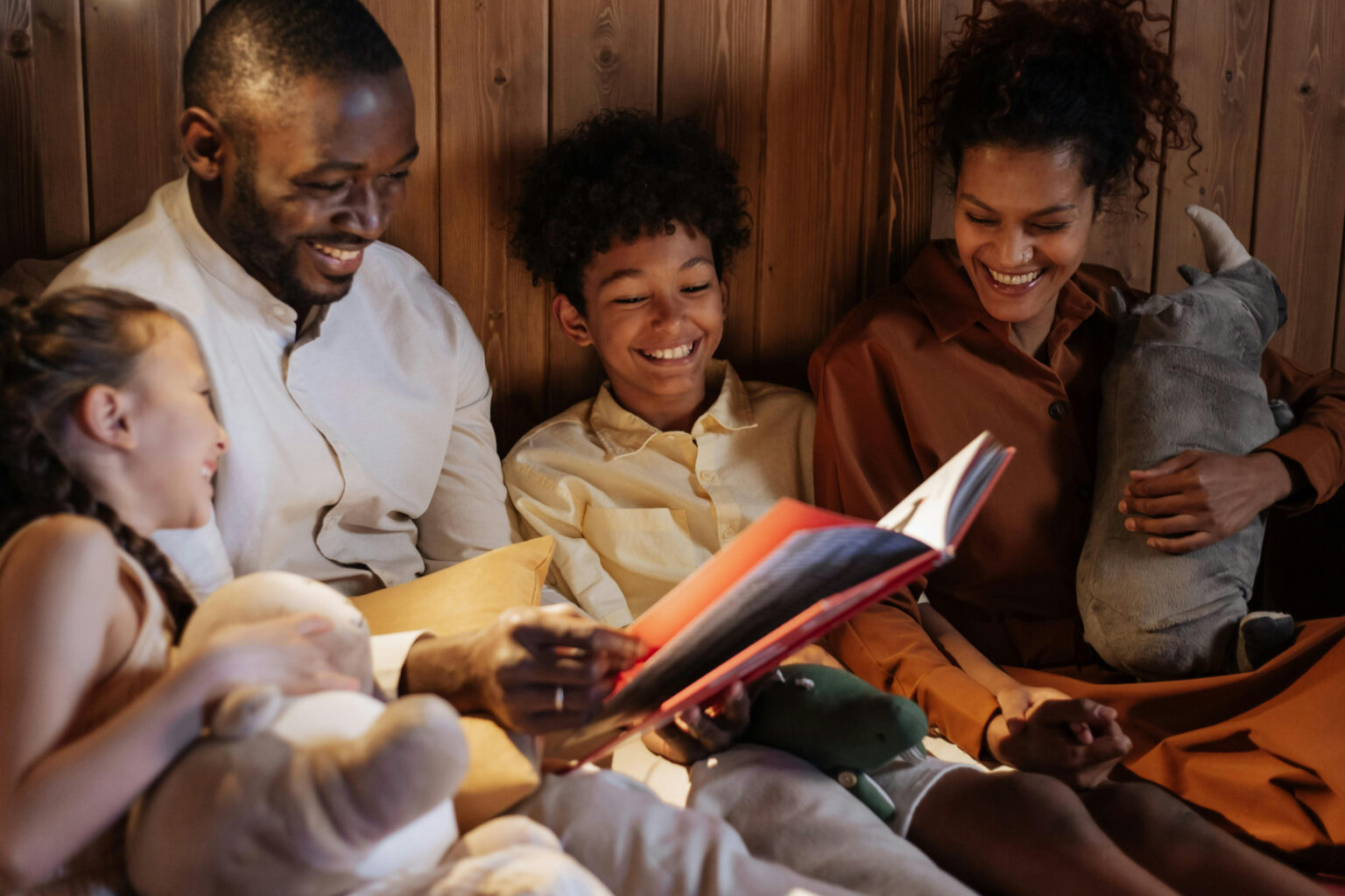 A family reading a picture book together