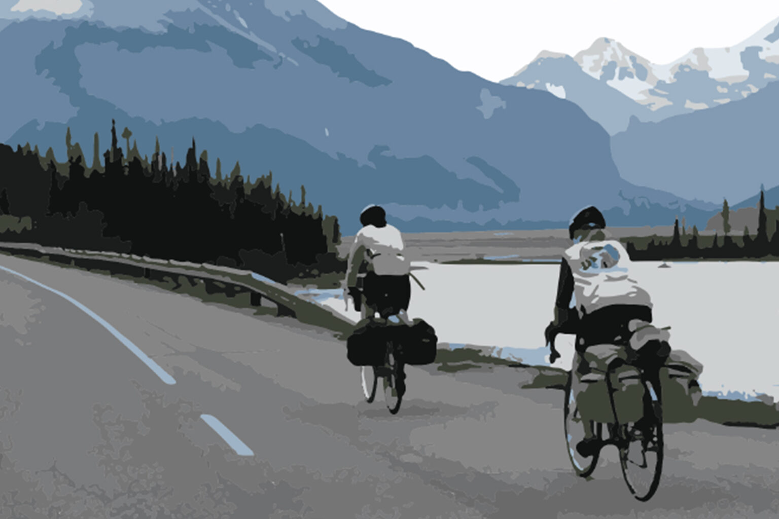 A mother and son riding bikes on a rode leading to mountains.