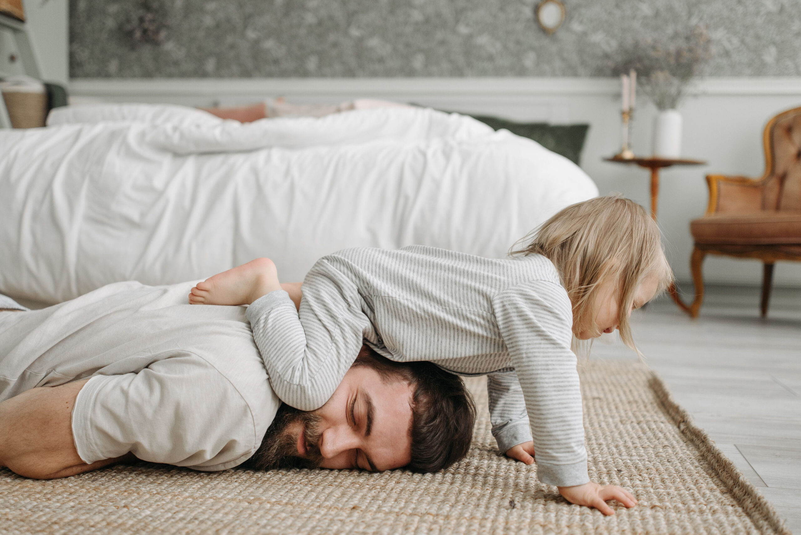 A child sitting on their father's head