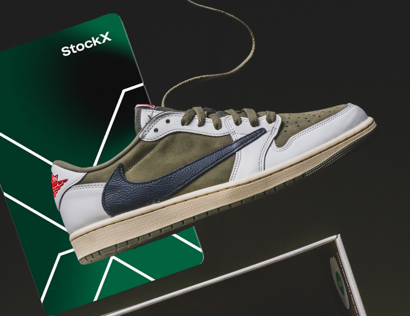 Sneaker dangling by a shoelace over a shoebox and enlarged gift card.